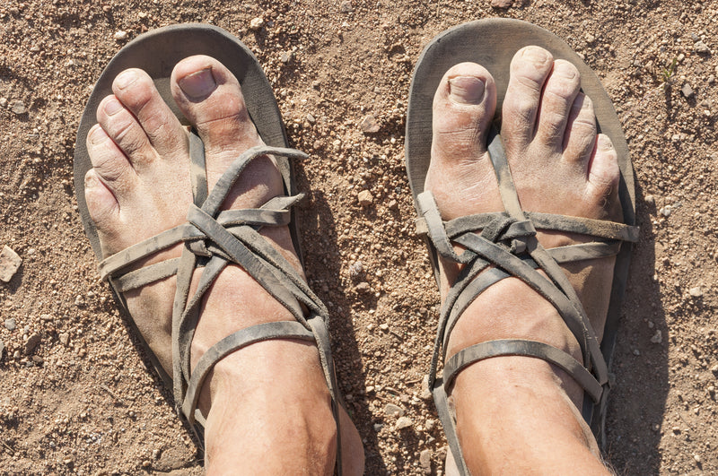 aos skincare image of feet on a beach